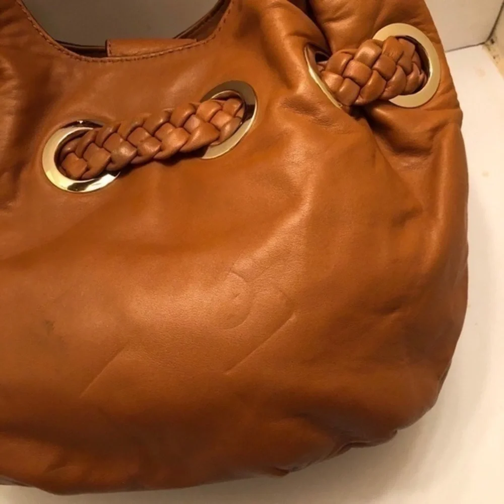 Michael kors brown leather grommet tassel bag